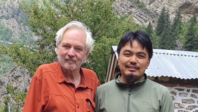 Photo of Norbu with snow leopard expert Rodney